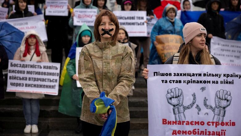 Antonina Danylevych is seen attending a November protest in Kyiv, which called for an end to open-ended military service in Ukraine.