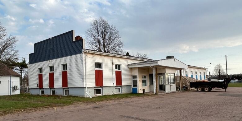 Building with a trailer out front