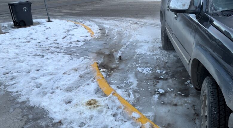 Icy conditions near an accessible parking space at 4th Avenue and Wood in downtown Whitehorse. Larochelle says frozen, snow-covered ramps like this one are extremely challenging to navigate by wheelchair. 