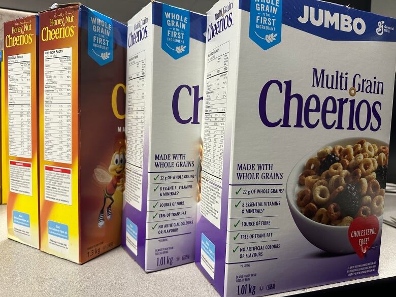 Two two-packs of Cheerios. One is honey nut flavour and one is multigrain. 