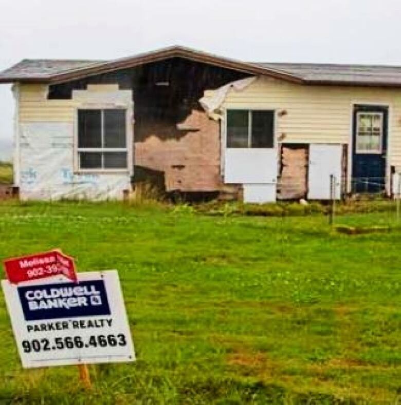 Damaged house for sale.