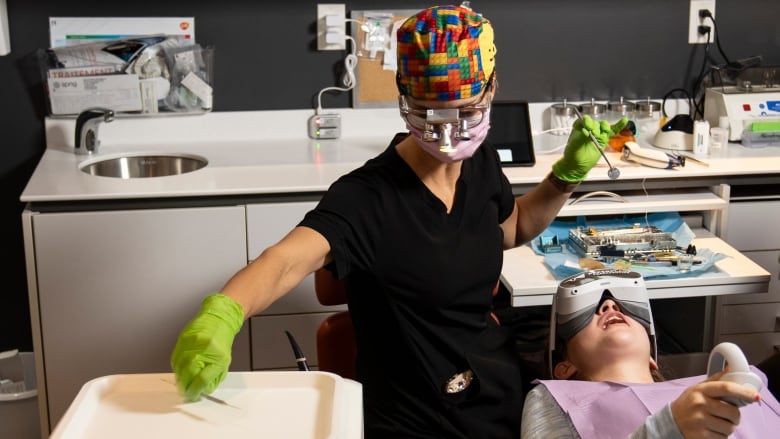 A patient in a dentist chair is pictured.