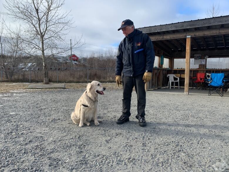 Portrait of a man and his dog.