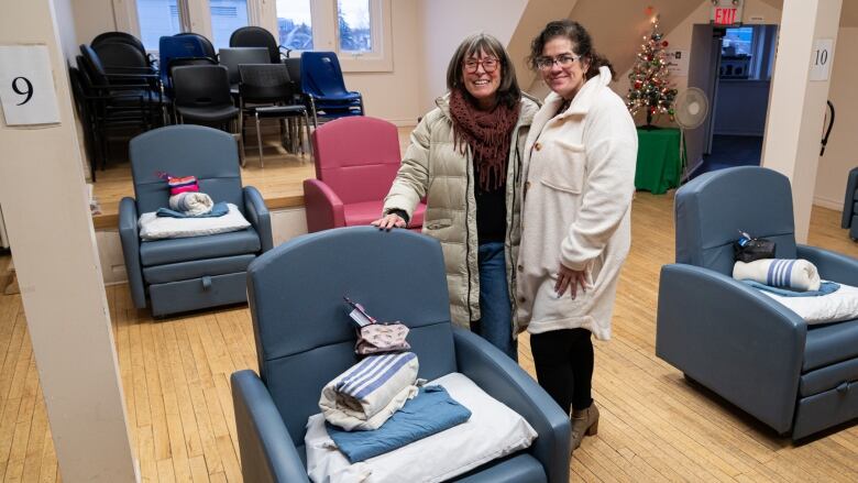 Karna Trentman, director of community programs for CMHA Thames Valley, and Sarah Campbell, executive director of Ark Aid Street Mission. Ten reclining chairs have been set up on the third floor of the shelter for an overnight space operated by Ark Aid.