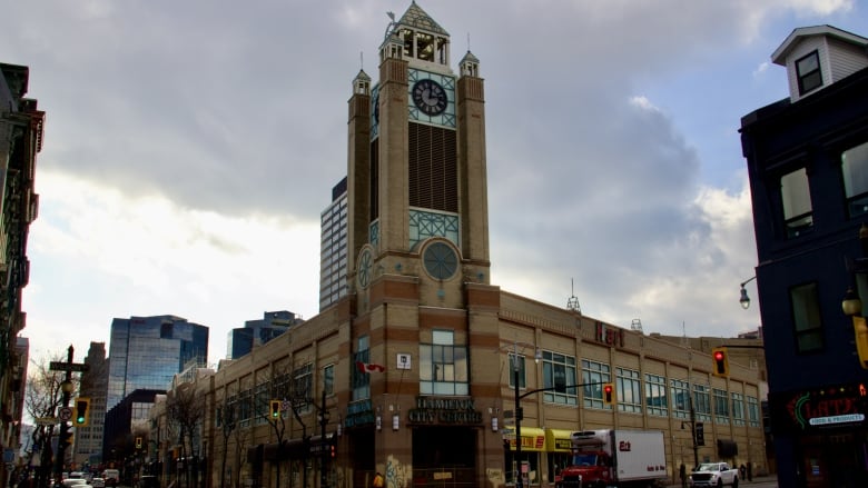 Clock tower and building on city street