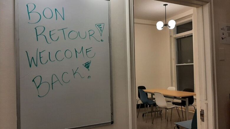 A whiteboard with a welcome sign.