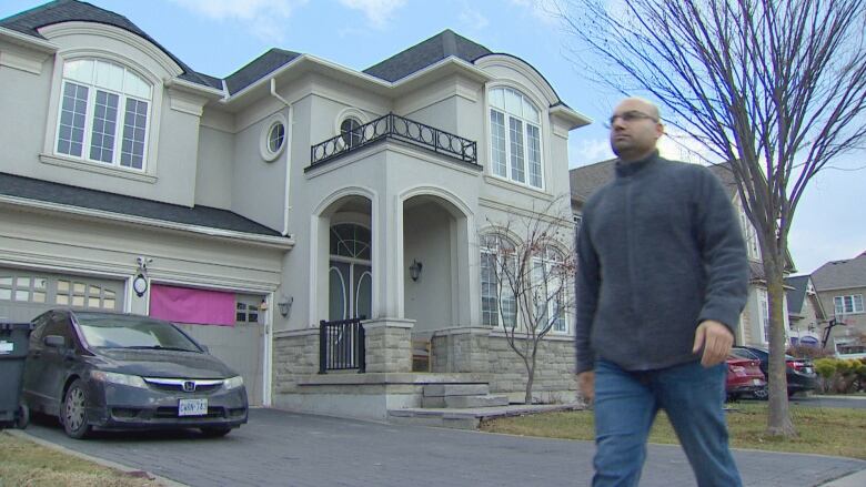 Rajan Kanwar walks past the four-bedroom house he owns on Scotchmere Cres. in Brampton. He says the tenant has paid no rent, or at best, partial rent,  since May, 2023. 