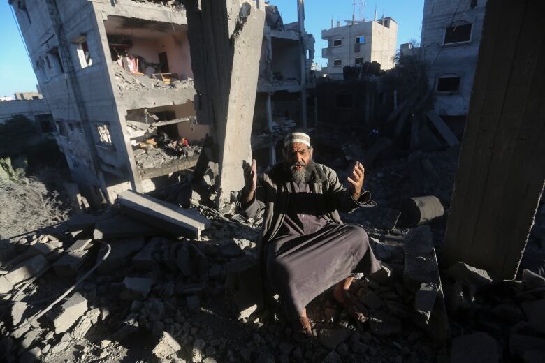 A man reacts in the aftermath of an Israeli airstrike on residential buildings in Rafah in the Gaza Strip.