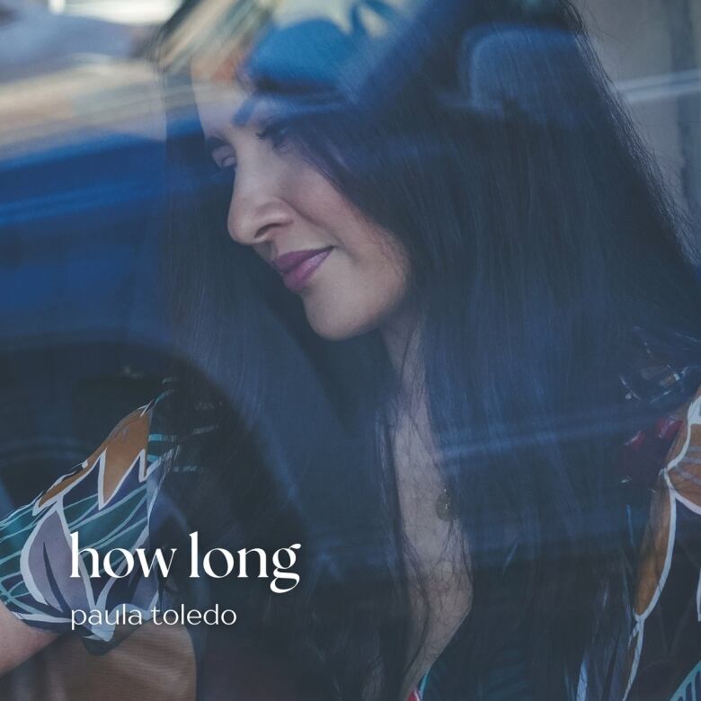 Promotional photo for Paula Toledo's 'How Long.' It shows a woman with long hair in profile.