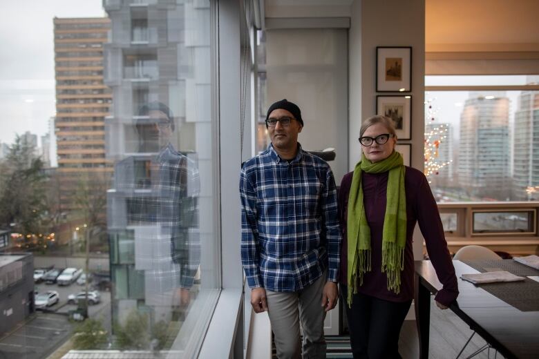 Kris Wallace and Andy Ali are pictured in their apartment in downtown Vancouver,  British Columbia on Thursday, December 14, 2023. 