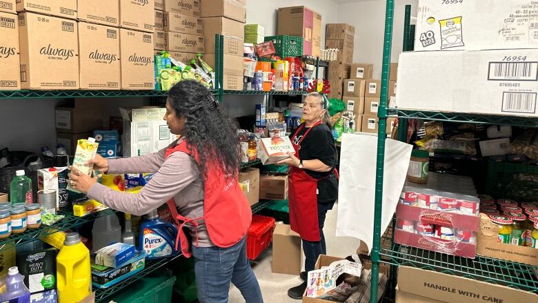 Staff and volunteers at the Salvation Army food bank in Sydney prepare for the Christmas distribution.