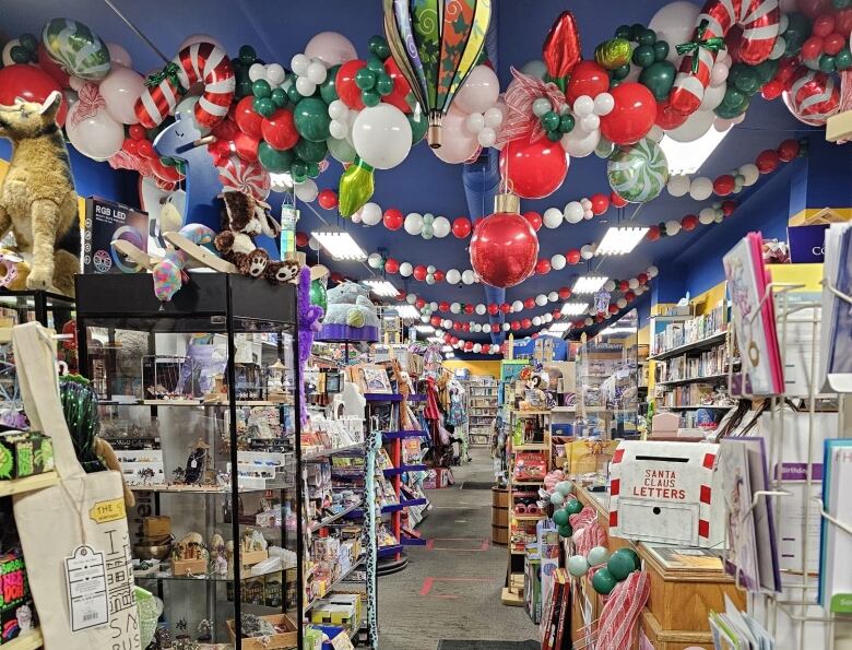 The interior of a toy store decorated for Christmas.