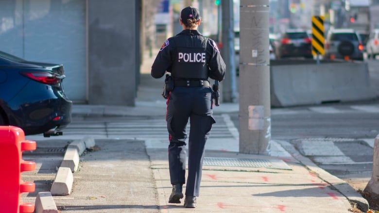 A police officer walking.