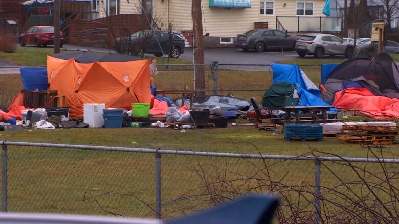 Tents are shown in a field.