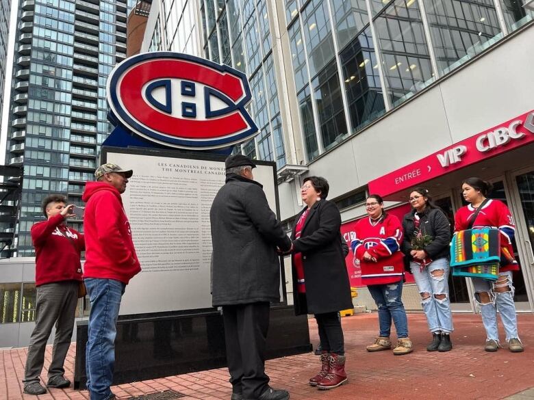 Montreal Canadian superfans get married under the Canadians logo. 