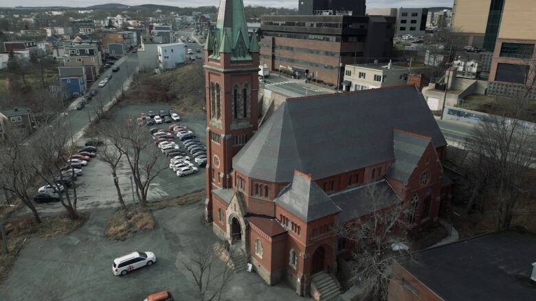 A red brick church, seen from above.