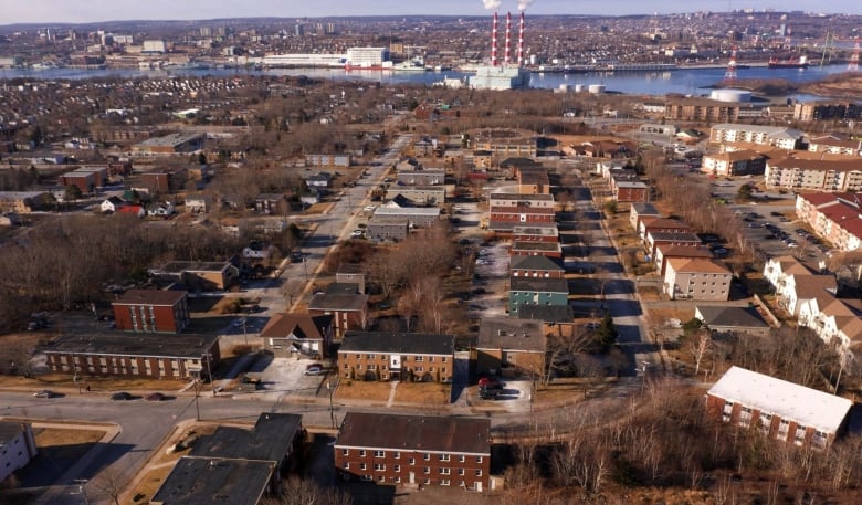 An aerial view shows multiple buildings and streets.