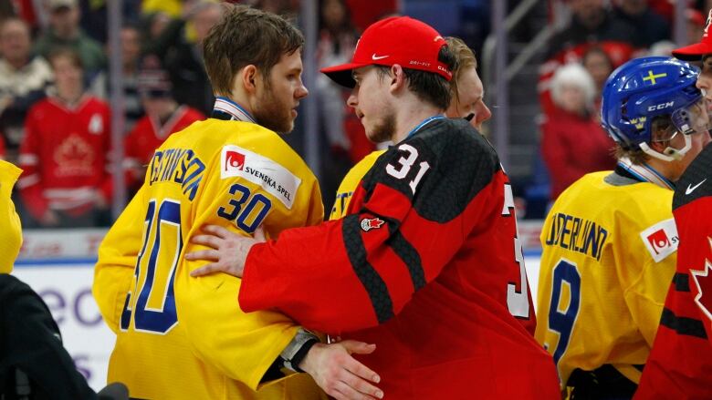 Two players shake hands