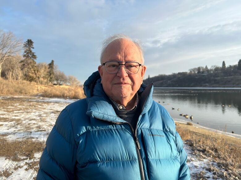 A man in a jacket by the Saskatchewan river.