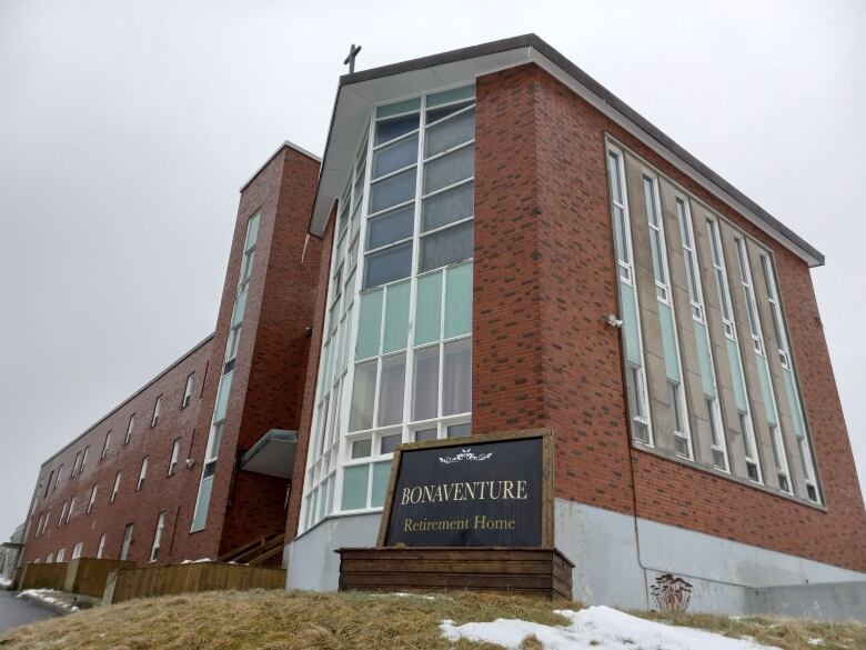 Exterior of a three-story brick building with a sign outside saying Bonaventure Retirement Home.