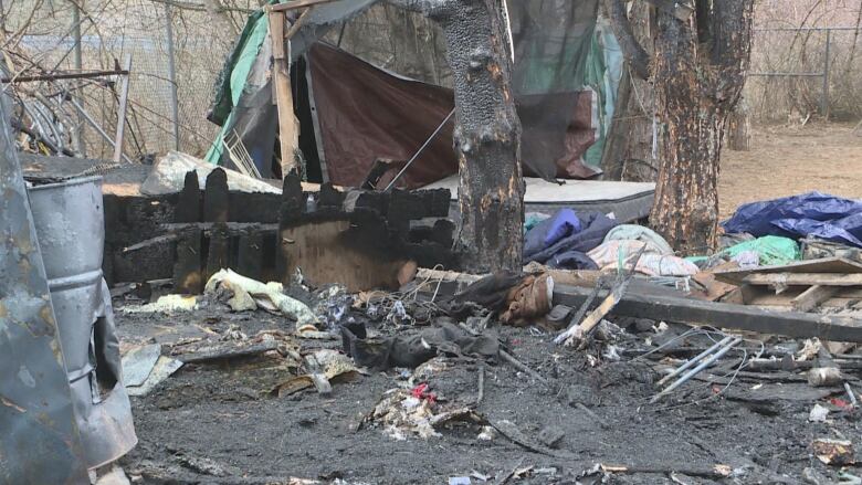 Charred ground and items.