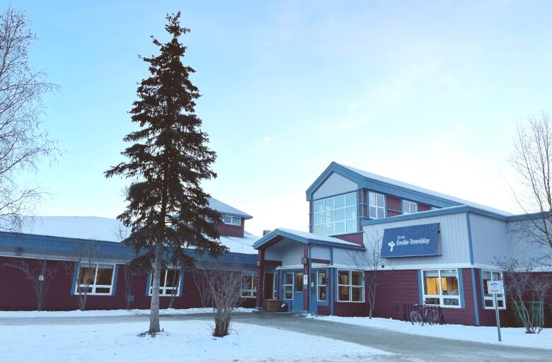 A school building is seen from the outside in winter.