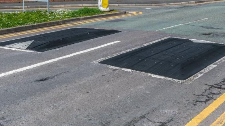 Street with camera focus on speed cushions