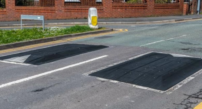 Street with camera focus on speed cushions