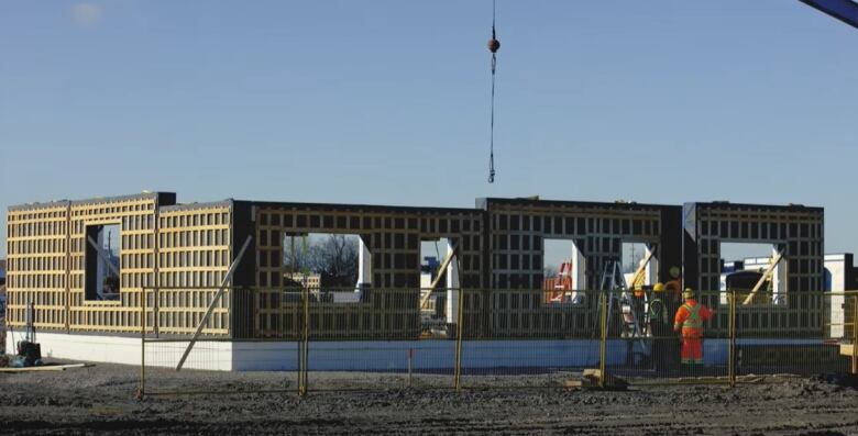 Construction crews build a home on the Caldwell First Nation reserve in Leamington.