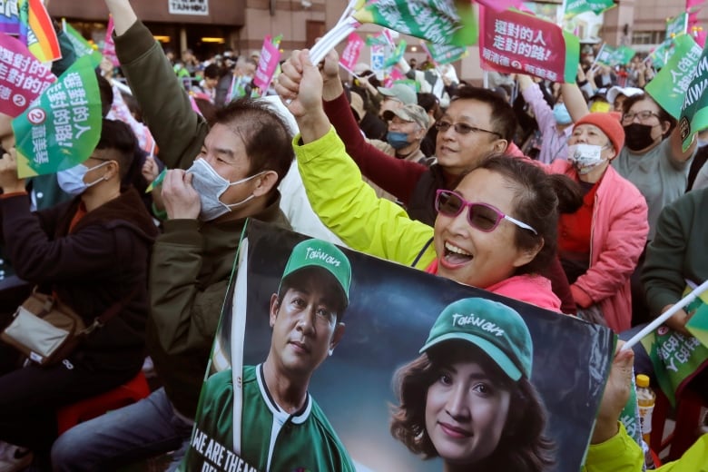 Supporters of Taiwan's presidential candidate Lai Ching-te cheer for election returns in Taipei, Taiwan. 