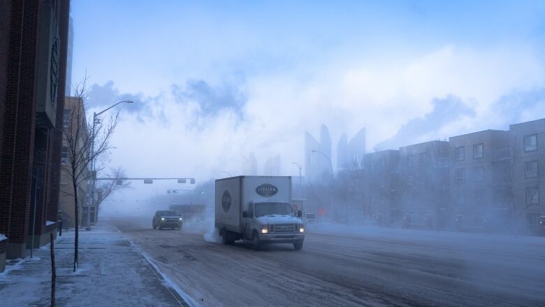 Ice fog in downtown Edmonton road as an Italian Centre truck drives by.