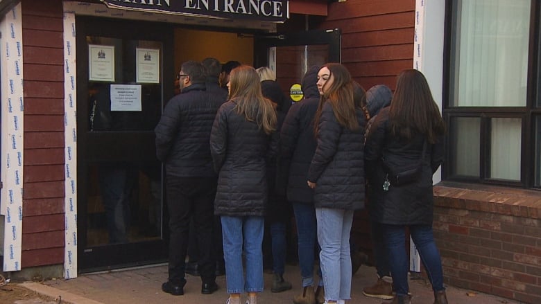 People lined up outside court.