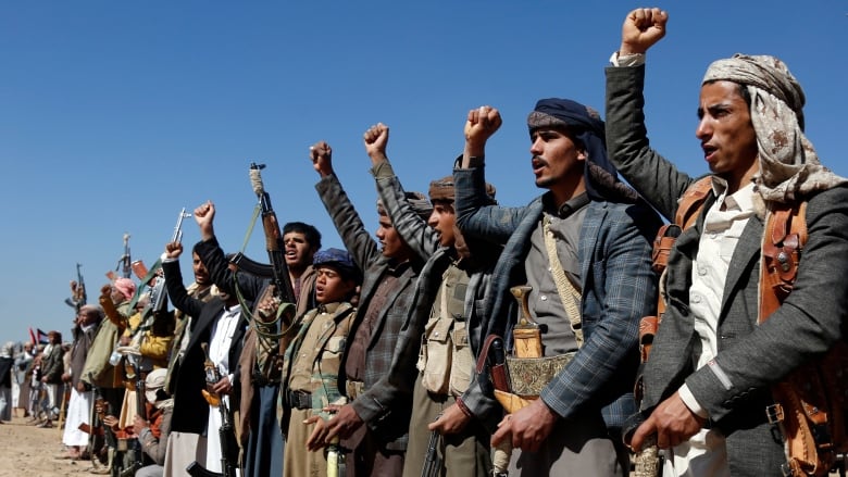 Houthi fighters and tribesmen stage a rally against the U.S. and the U.K. strikes on Houthi-run military sites