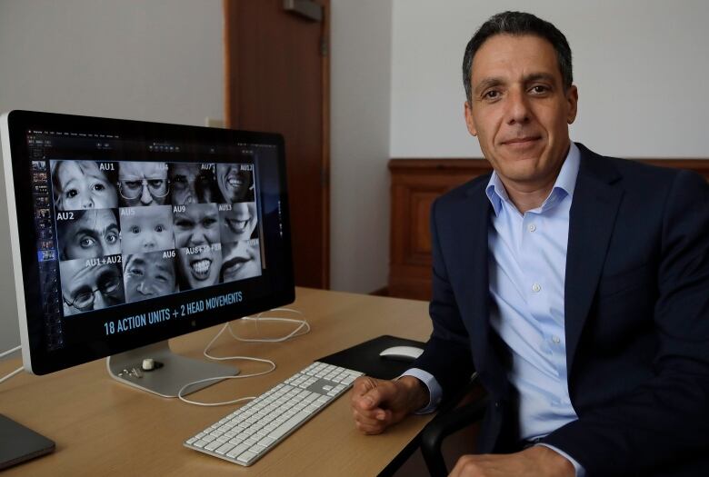 In this Monday, July 1, 2019, photo Hany Farid, a digital forensics expert at the University of California at Berkeley, poses for a photo while taking a break from viewing video clips in his office in Berkeley, Calif. Sophisticated phony videos called deepfakes have attracted attention as a possible threat to election integrity. But a bigger problem for the 2020 U.S. presidential contest may be dumbfakes. The fact that these videos are made so easily and then widely shared across social media platforms does not bode well for 2020, said Farid. (AP Photo/Ben Margot)