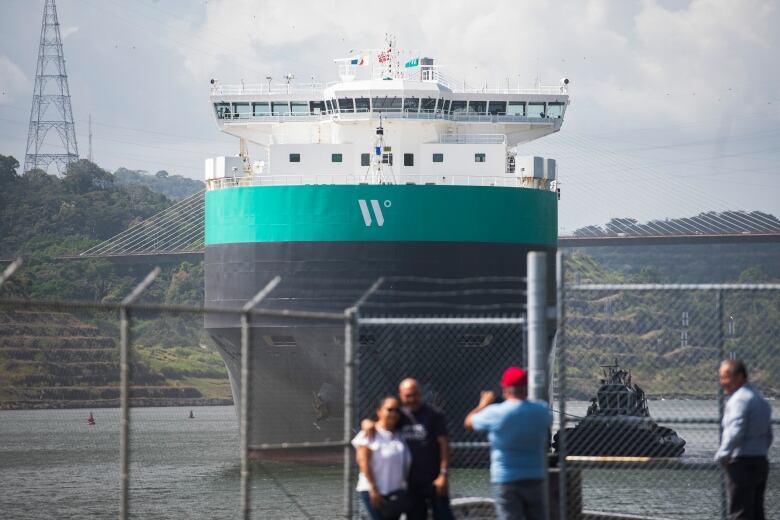 A cargo ship passing through the Panama Canal.