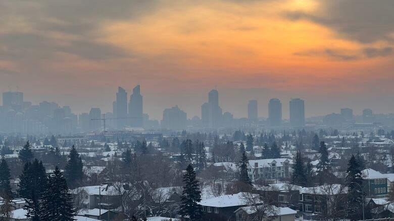 Calgary skyline is shown, blanketed in smog.