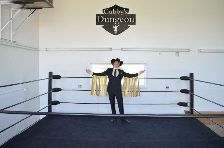 Levi Day stands in the middle of the homemade wrestling ring made by his dad, Larry Day.