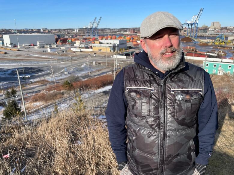 Bryan Wilson poses in front of the AIM scrap yard