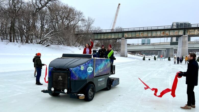 A vehicle drives on ice.