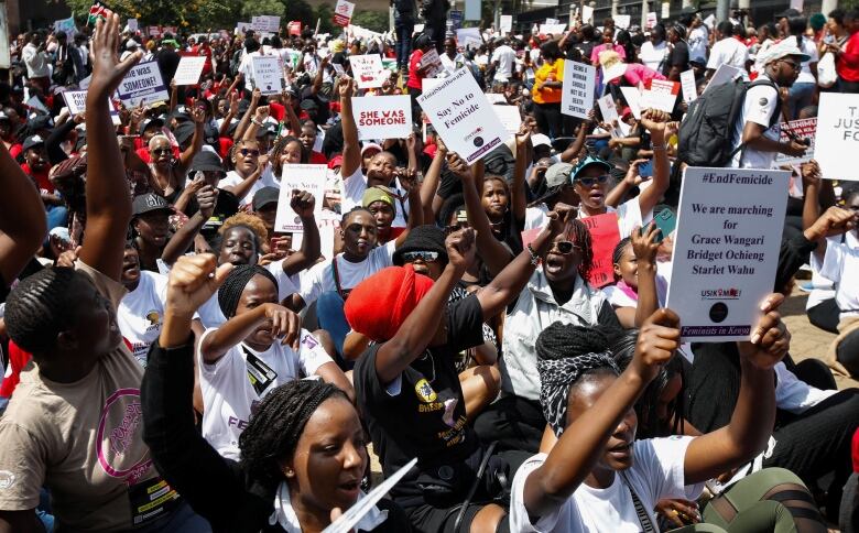 Top shot of a large crowd of protesters, many of them women.