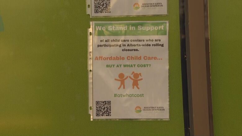 a poster is seen on a green wall.