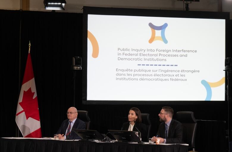 University of Montreal professor Pierre Trudel,  Carleton University professor Leah West and University of Calgary professor Michael Nesbitt are seen during a panel discussion at the Public Inquiry Into Foreign Interference in Federal Electoral Processes and Democratic Institutions begins, in Ottawa, Tuesday, Jan. 30, 2024. 