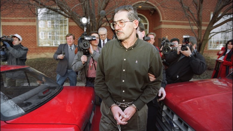 Aldrich Ames is seen leaving a U.S. federal courthouse in Alexandra, Va., after being arraigned on spying-related charges on Feb. 22, 1994.