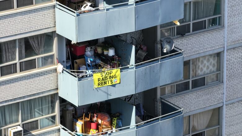 An apartment building with a sign saying 