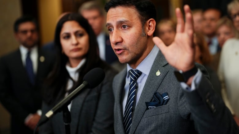 Justice Minister and Attorney General of Canada Arif Virani talks to media in the foyer of the House of Commons