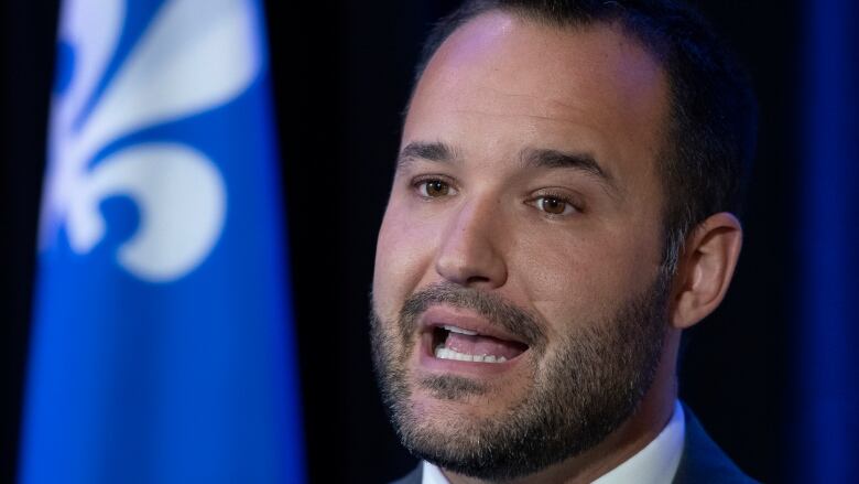 Quebec Family Minister Mathieu Lacombe responds to reporters questions at the beginning of a pre-session caucus meeting Wednesday, September 8, 2021