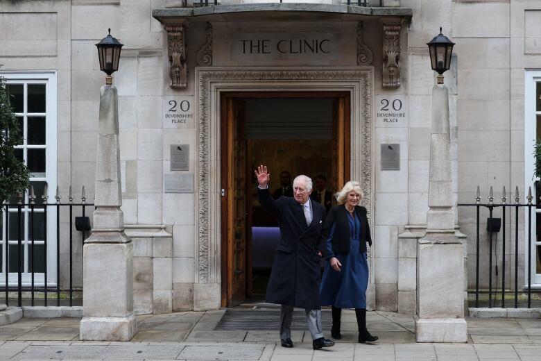 King Charles and wife Camilla walking out of the London Clinic.