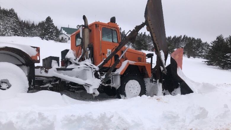 Plow stuck in the snow.