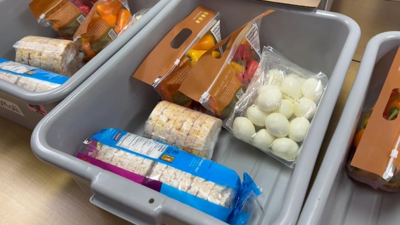 A bin with food in it.