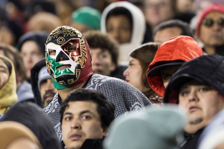 A Chivas Guadalajara fan wears a wrestling mask in the stands during round one of the 2024 CONCACAF Champions Cup against Hamilton Forge FC in Hamilton on Wednesday, February 7, 2024. 